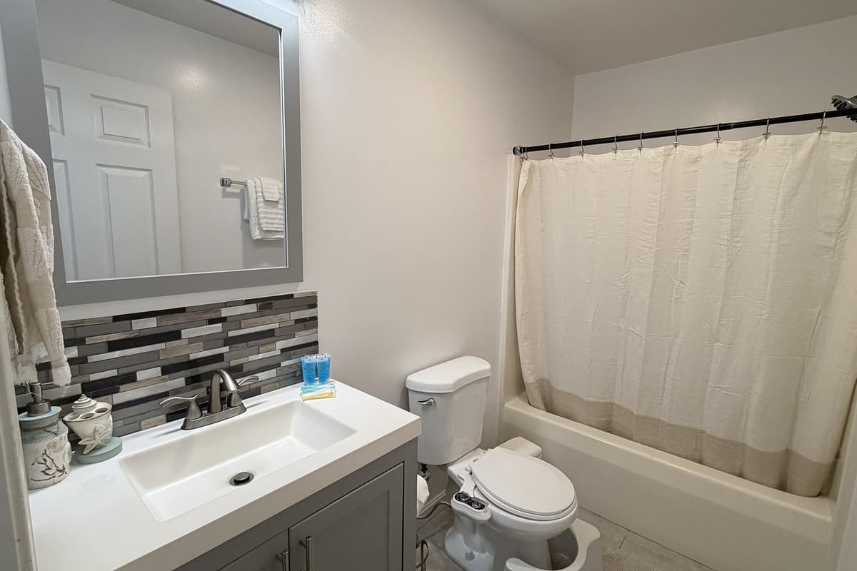 Full bathroom with tub and shower