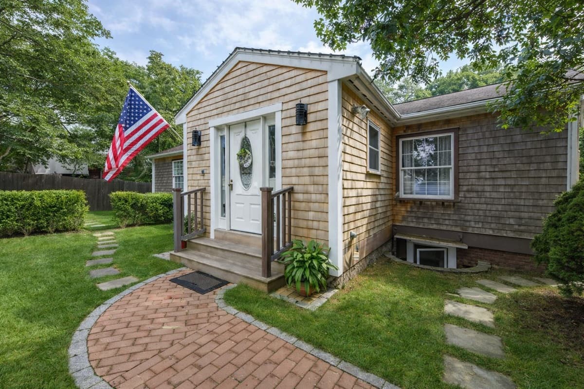 Welcoming front entrance with classic cedar-shingle charm