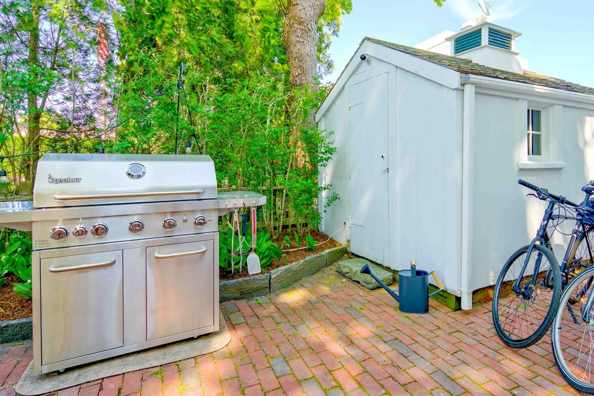 Backyard Patio with Grill and Bikes