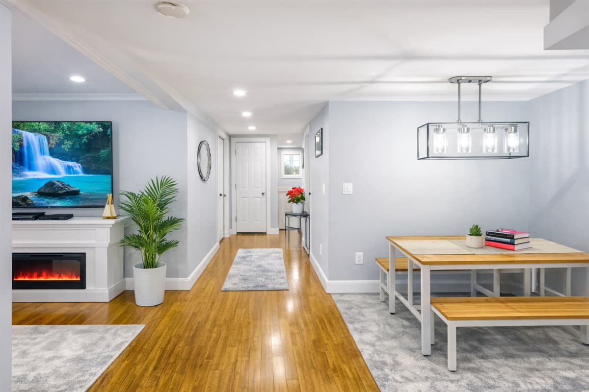 Dining area with electric fireplace and smart TV
